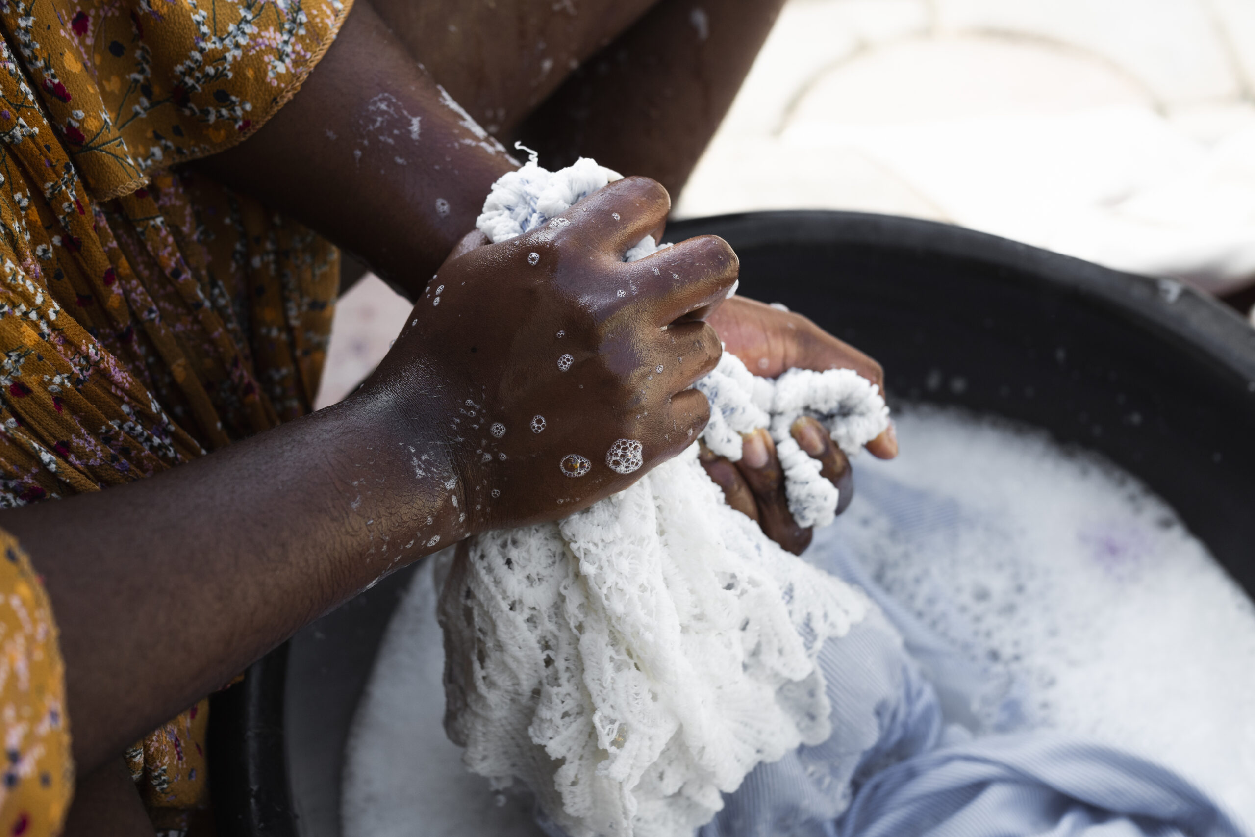close-up-hands-washing-laundry
